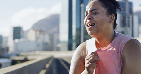 Woman, fitness and tired from running in city for health, cardio endurance and sweating. Breathing,...
