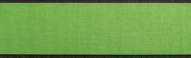A flat, rectangular piece of vibrant lime green material