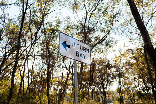 U turn bay sign with arrow in bushland at  Battery Rocks Rest Area on side of highway