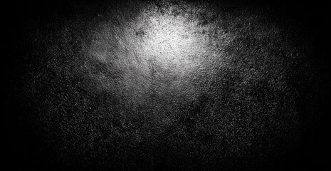 Dark textured surface with a light center