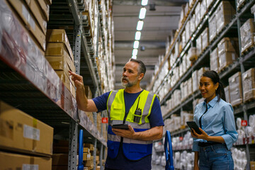 Fototapeta premium Logistics employee is service customer at warehouse.