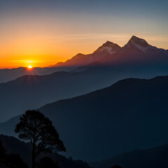 Majestic Mountain Range Silhouetted at Sunset with Golden Sky.
