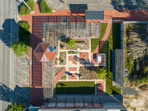 Overhead view of a landscaped public garden with gazebo and pathways