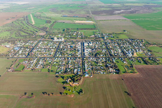 Aerial view of the township of Rainbow surrounded by farmland.