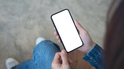 Mockup, blank screen cell phone. Woman hand holding, using mobile phone at cafe with white empty space for advertise text. contact business, social media communication, technology device, closeup