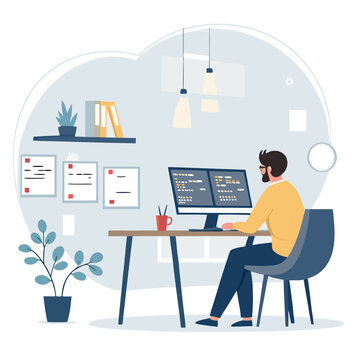 Male programmer focused on writing code at his modern workspace.