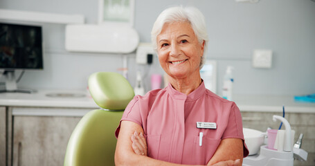 Arms crossed, portrait and healthcare with woman dentist in office for oral care or teeth whitening. Appointment, hygiene and smile with mature dental professional in clinic for consultation