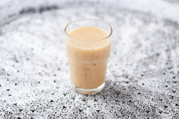 Pineapple coconut smoothie on bright background. Soft focus. Copy space.	