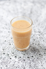 Pineapple coconut smoothie on bright background. Soft focus. Copy space.	