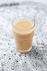 Pineapple coconut smoothie on bright background. Soft focus. Copy space.	
