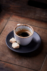 Cup of coffee on rustic wooden background. Soft focus. Copy space	