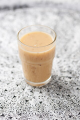 Pineapple coconut smoothie on bright background. Soft focus. Copy space.	
