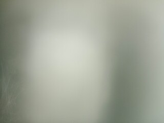 This abstract background features a subtle gradient of light and dark tones creating a soft and ethereal mood perfect for artistic projects.