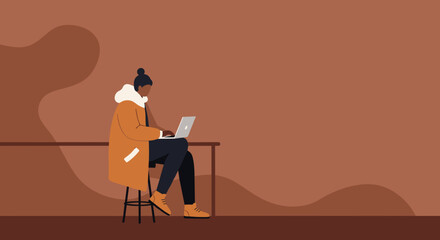 Modern person working remotely on laptop in a cafe or co-working space, demonstrating productivity, flexible lifestyle, or digital nomadism.