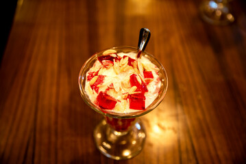 Closeup of a Sweet Strawberry Milkshake in a Glass With a Spoon