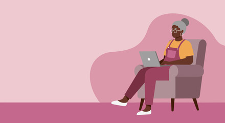 Elderly Black woman focused on her laptop in a comfortable armchair at home. Represents remote work, online learning, and digital engagement for seniors.