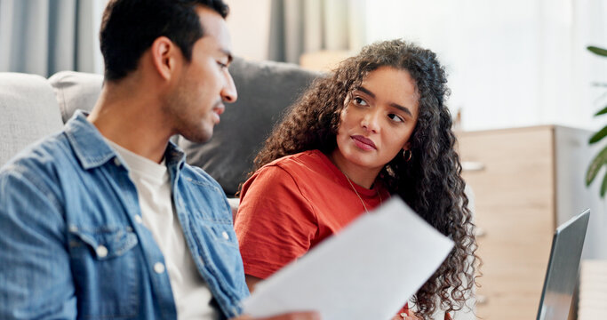Serious, couple and talking with document at house for finance planning, payment error and bankruptcy. People, listening and laptop for loan paperwork, budget mistake and worry for home repossession