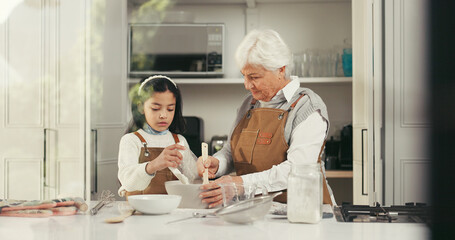 Baking, mixing and child with grandmother in kitchen for teaching, bonding or development. Happy,...