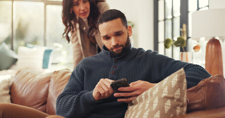 Phone, relax and social media with man on sofa in living room of home for internet browsing. App,...