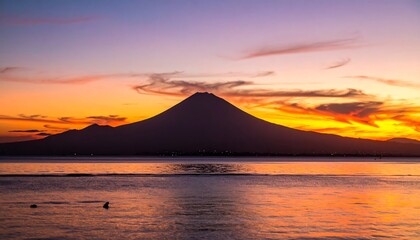 Volcanic sunset over water