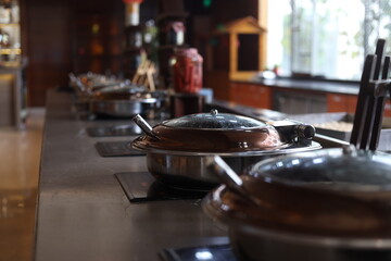 Stainless steel food warmer in a restaurant or buffet