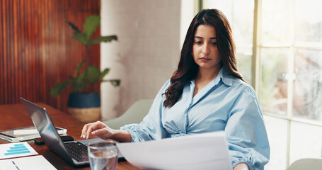 Laptop, document or business woman in office with graphs for investment analytics, review or stats. Computer, financial advisor or reading paperwork with chart for budget, risk management or analysis