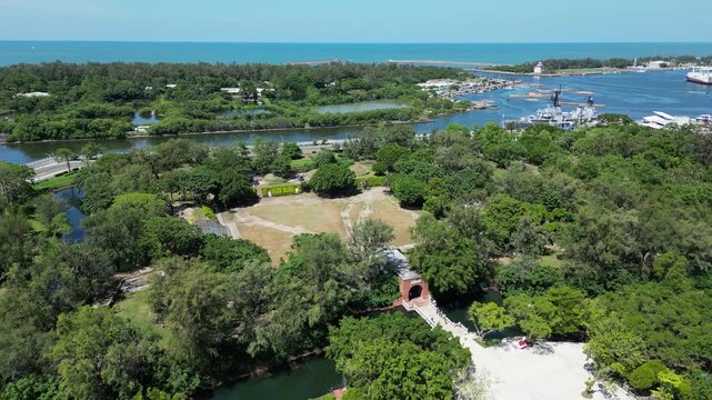 Aerial drone view of the historic Eternal Golden Castle (Erkunshun Fortress) and moat, with the Anping Harbor cityscape in summer. Tainan, Taiwan. Chinese translation : Yi Tzai Golden Castle