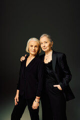Embracing love and elegance, a mature lesbian couple showcases their unique style together