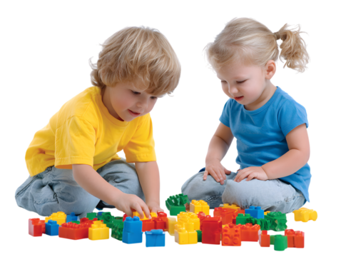 Two cute toddlers playing together with colorful building blocks.
