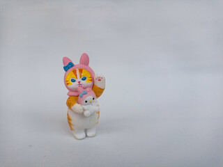 Cute collectible cat figurine with whimsical design, symbol of playfulness, innocence, and kawaii...