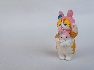 Cute collectible cat figurine with whimsical design, symbol of playfulness, innocence, and kawaii culture.