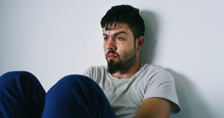 Thinking, man and anxiety with withdrawal at house of drug addiction, substance abuse and solitude....