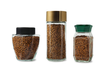 Three transparent glass jars of different shapes with instant coffee, showing its rich brown texture.