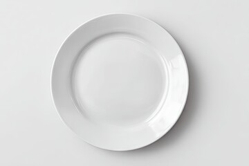 A clean, empty, white dinner plate sits centrally on a plain white background, viewed from directly above
