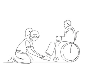 A girl tie shoelaces to disable man