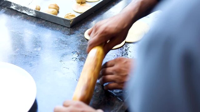 Making roti or bread with a kitchen rolling pin