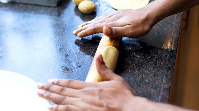 Making roti or bread with a kitchen rolling pin