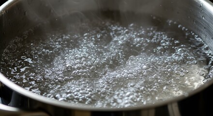Boiling water in a stainless steel pot