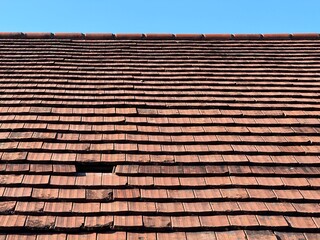 A Classic Clay Tile Roof against a beautiful Blue Sky backdrop