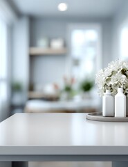 Interior showcases a clean, bright kitchen with a white counter in the foreground and blurred shelving and flowers, conveying a sense of airy calm