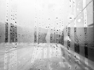 Rain droplets on glass window surface