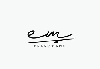 EM letter elegant cursive beauty handwriting logo.