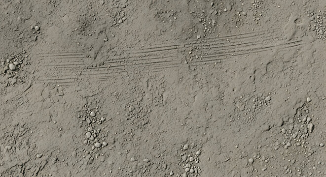 Sandy ground texture with small stones and tire tracks in a neutral color