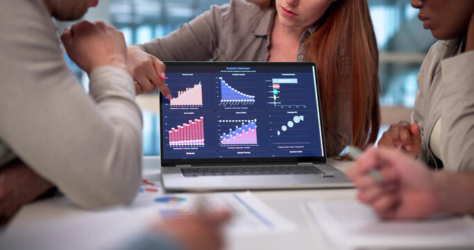 Multicultural Team Analyzing Financial Data On Virtual Dashboard