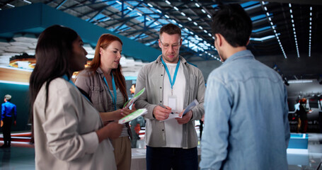 Busy Team Of Diverse Employees At Technology Showcase