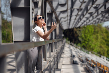 Woman making selfie at the mobile phone while relaxing