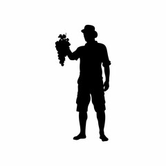 Proud farmer silhouette holding a bunch of grapes