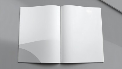Open blank notebook on a smooth gray surface