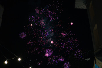 Colorful fireworks exploding in the night sky, creating a festive celebration atmosphere. Bright...