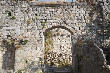 Fototapeta premium Exploring the storied ruins of Stari Bar, this site reveals remnants of ancient architecture nestled in Montenegro old town. Nature intertwines with history in this captivating location